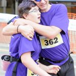 Trevor and Katie Lewis embrace after completing last year’s Thunder Bay Marathon. (Photo courtesy of Thunder Bay Chronicle-Journal/Brent Linton. Used by permission.)