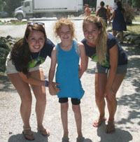Alexa Graham poses with two counsellors at Camp Couchiching.