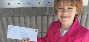 Miah Wheadon is seen here getting ready to mail the proceeds she raised through her 2015 Purple Day campaign to Epilepsy Ontario. 